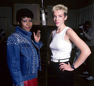 Annie Lennox and Aretha Franklin - behind every great man there's a great woman
